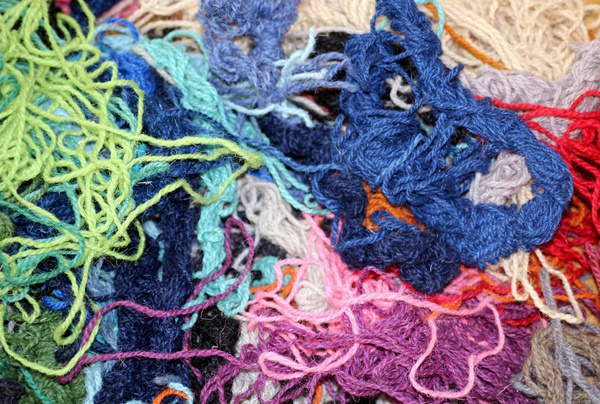 Hopelessly tangled multi-colored yarn, representing a poorly organized mono-repo with spaghetti dependencies